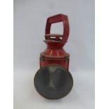 A red railway lamp.