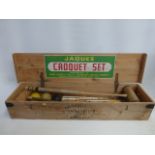 A Jaques of London croquet set within a pine box.