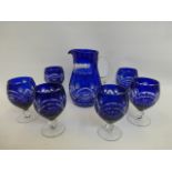 A six setting Bohemian blue glass jug and goblet lemonade set.