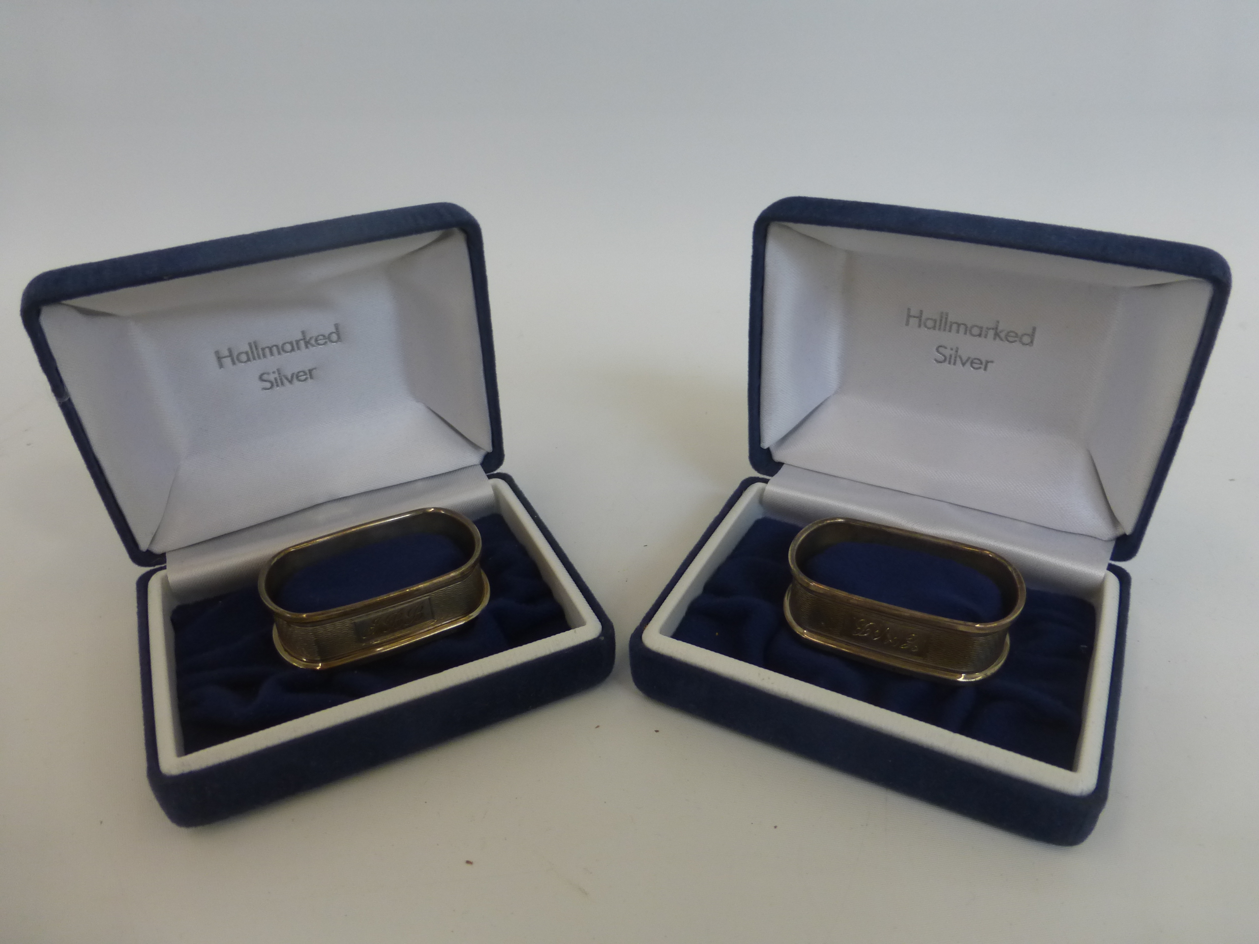 Two cased silver napkin rings, maker - B and Co, Birmingham,1993.
