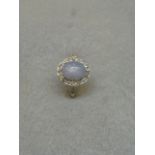 A diamond and star sapphire ring, size O.