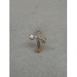 A gold diamond twist dress ring, size Q.