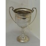 A large twin handled silver trophy with inscription "Caversham Trophy" Best Dog of the Year, bred