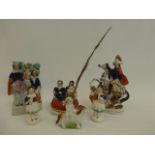 A group of six 19th Century Staffordshire figures including a girl sat on a dog, also a quill