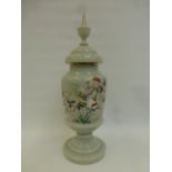 A large late 19th Century opaline lidded vase with painted decoration depicting apple blossom, a