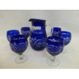 A six setting Bohemian blue glass jug and goblet lemonade set.