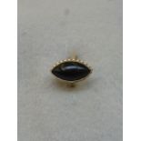 A jet and gold marguise dress ring with heart shaped bezel, size N.