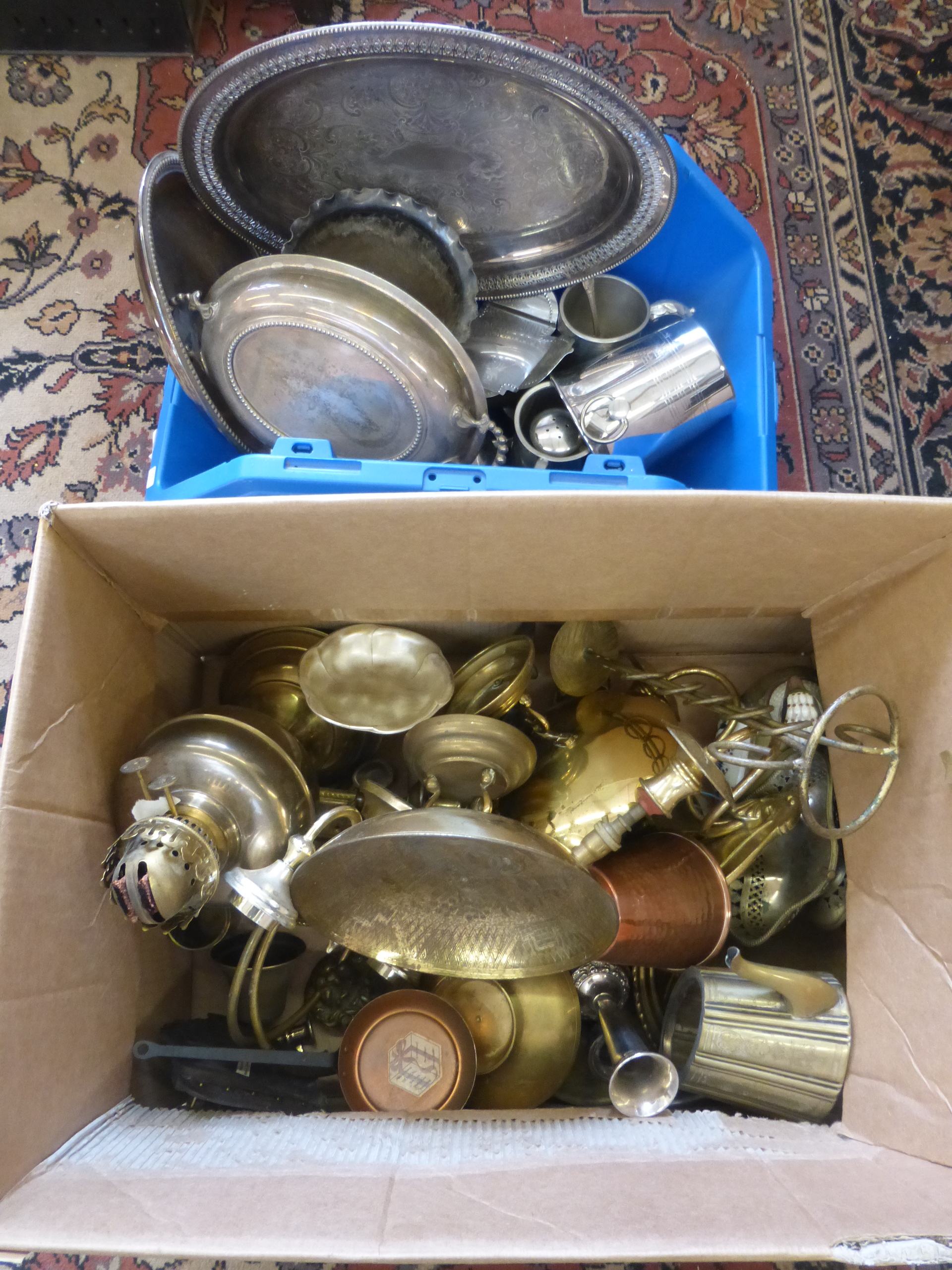 A box of assorted brassware and copper, also a box of assorted silver plated tableware.