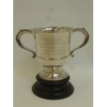A twin handled silver trophy with ebonised stand with inscription B.B.W.E.P.A. "The Presidents