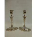 A pair of Regency style silver candlesticks with inscription B.B and W. of E.P.A. "The Rosa Tudgay