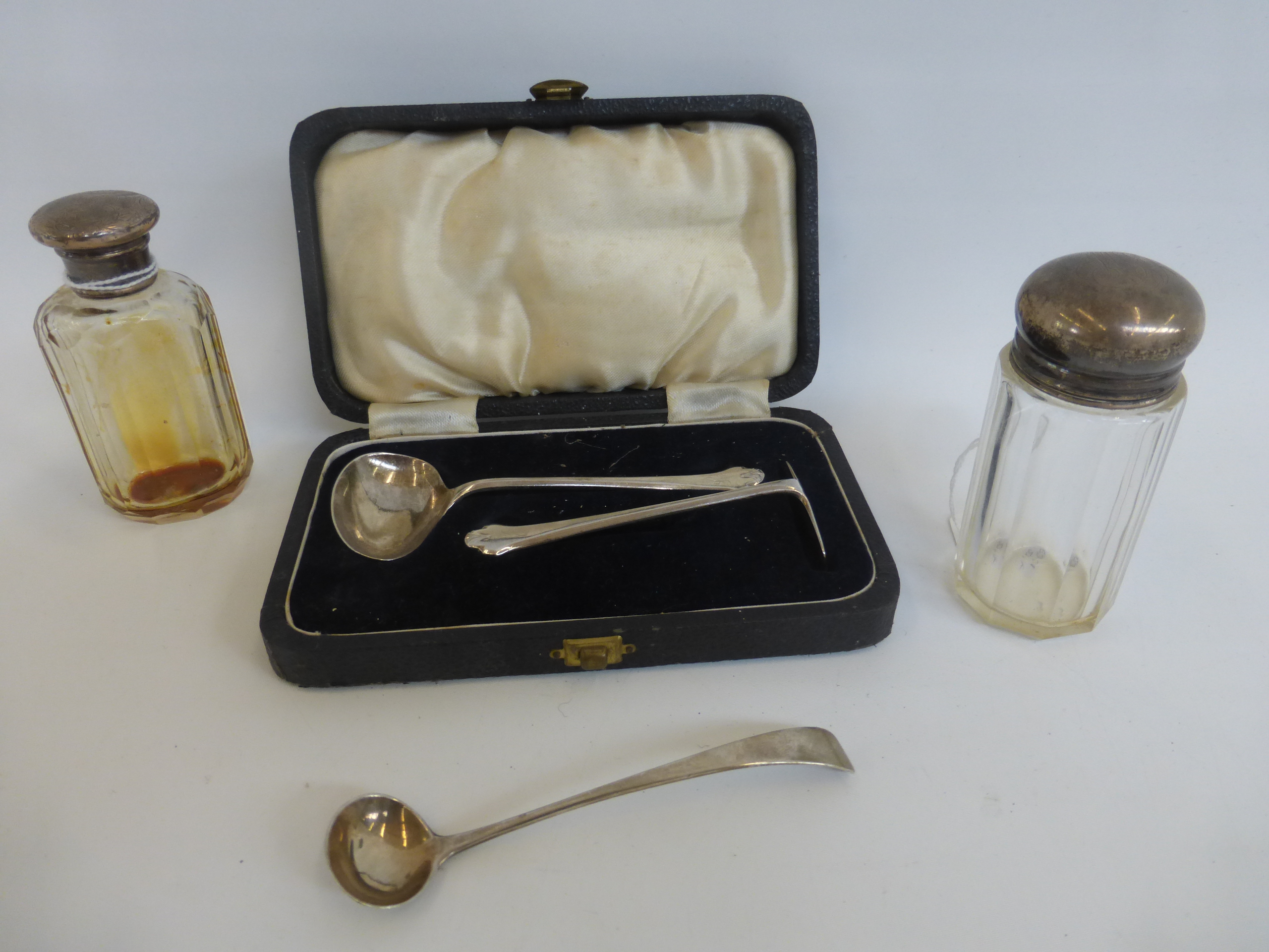 A cased silver push-pull Christening set, maker- E.J.M.J, Sheffield, 1941, two silver topped jars