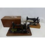 A Wertheim sewing machine, the case with parquetry inlay and a Singer sewing machine uncased.