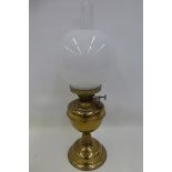 A Duplex brass oil lamp with funnel and shade.
