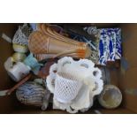 A box of assorted mixed collectables including a wall pocket, cream ware, tiles, a majolica cockle