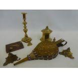 An assortment of brassware including a hexagonal shaped lidded pot, bellows, candlestick etc.