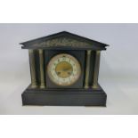 An early 20th Century slate mantel clock in the form of a Roman temple.