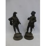 A pair of spelter figures depicting French cavalier swords men.