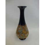 An early 20th Century Royal Doulton bulbous shaped vase with tapering neck, eleven inches tall.