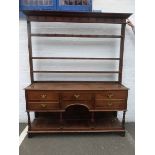 A late 18th /early 19th Century oak dresser of five drawers with panelled pot board below and open