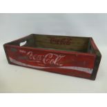 A wooden Coca Cola advertising crate.