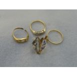 An assortment of five 18ct gold rings (all damaged).