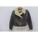 A lady's leather and faux sheepskin jacket.