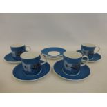 A set of four Wedgwood Susie Cooper design king-fisher "camelia" coffee cans and saucers.