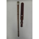 An Eastern carved wooden page turner and a leather swagger stick with silver plated knop.