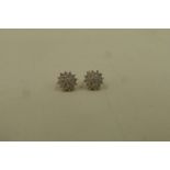 A pair of 9ct gold diamond encrusted stud earrings stamped 375 25pt.