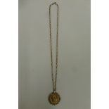 A 9ct gold pendant necklace, the pendant set with a 2001 half sovereign bordered in a laural leaf