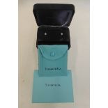 A pair of TIFFANY & Co. diamond solitaire stud earrings in original box.