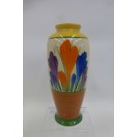 A Clarice Cliff Wilkinson Bizarre Crocus pattern vase, 140 mm high, good condition.