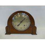 An Art Deco oak cased mantel clock inscribed Garrard to the movement.
