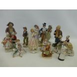 Eleven assorted ceramic group and single figurines including Hummel, Karl Ens etc.