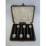 A cased set of six silver coffee bean teaspoons, maker Adie Brothers, Birmingham 1926.