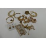 An assortment of 9ct gold earrings and spares etc. total weight 16g.