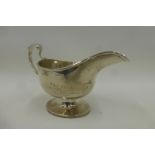 A silver pedestal sauce boat, maker - George Nathan and Ridley Hayes, Chester 1915.