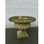 A large Haddonstone "Clarence Urn" with pedestal base.