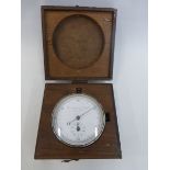 A mahogany cased Thomas Armstrong and Brother Manchester pocket stopwatch.