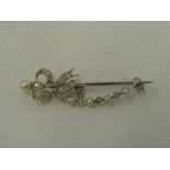 A 15ct white gold brooch set with five pearls and twenty seven diamonds, unmarked, tested as 15ct.