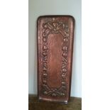 A Newlyn copper rectangular tray decorated with rosehips, stamped maker's mark Newlyn.
