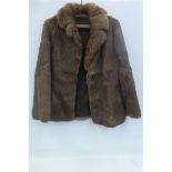 A simulated fur jacket made in China, size 10.