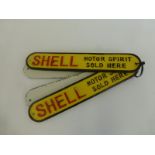 A set of four elongated cast metal Shell wall plaques.