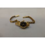 A 9ct gold Accurist Diamond lady's wristwatch with 9ct gold strap, 9.3g.