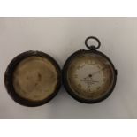 A leather cased Negretti and Zambra pocket barometer, London 1809.