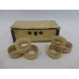 A 19th Century ivory lidded box and a set of six napkin rings.