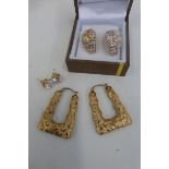 Two pairs of 9ct gold hooped earrings including a pair of CZ solitaire stud earrings.
