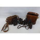 Two leather cased military binoculars, one pair stamped Bausch & Lomb Optical Co. Rochester N.Y.,