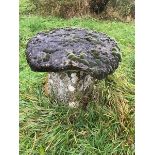 A large period stone staddle stone with top.