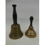 Two late 19th Century/ early 20th Century brass hand bells with turned ebonised handles.